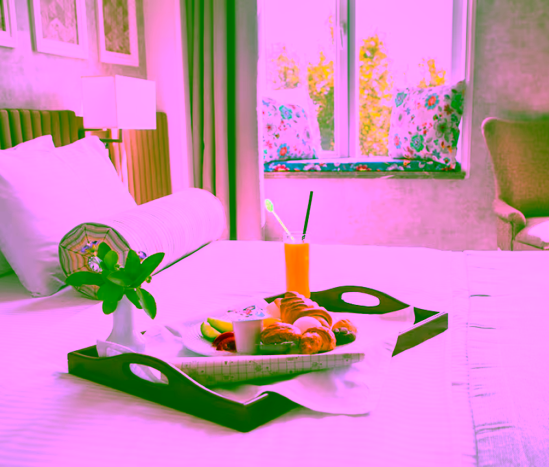 croissant-boiled-egg-orange-juice-yogurt-breakfast-tray-bed-hotel-room_176474-2601